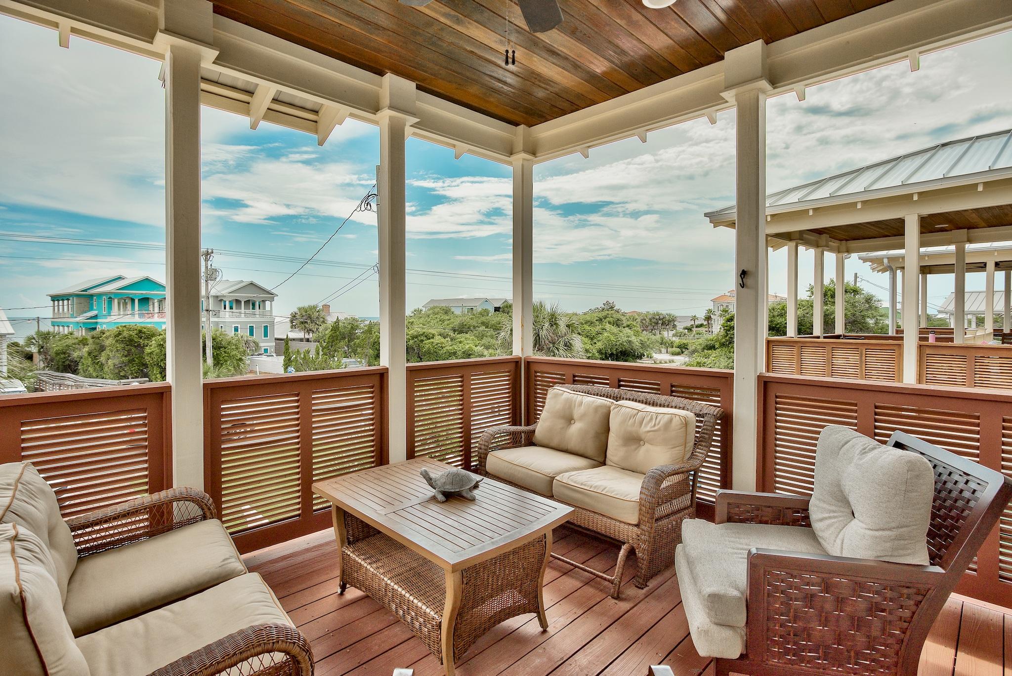 8045 East County Highway 30A Inlet Beach, FL 32461 - Photo 33 of 38 a living room with furniture and a large window