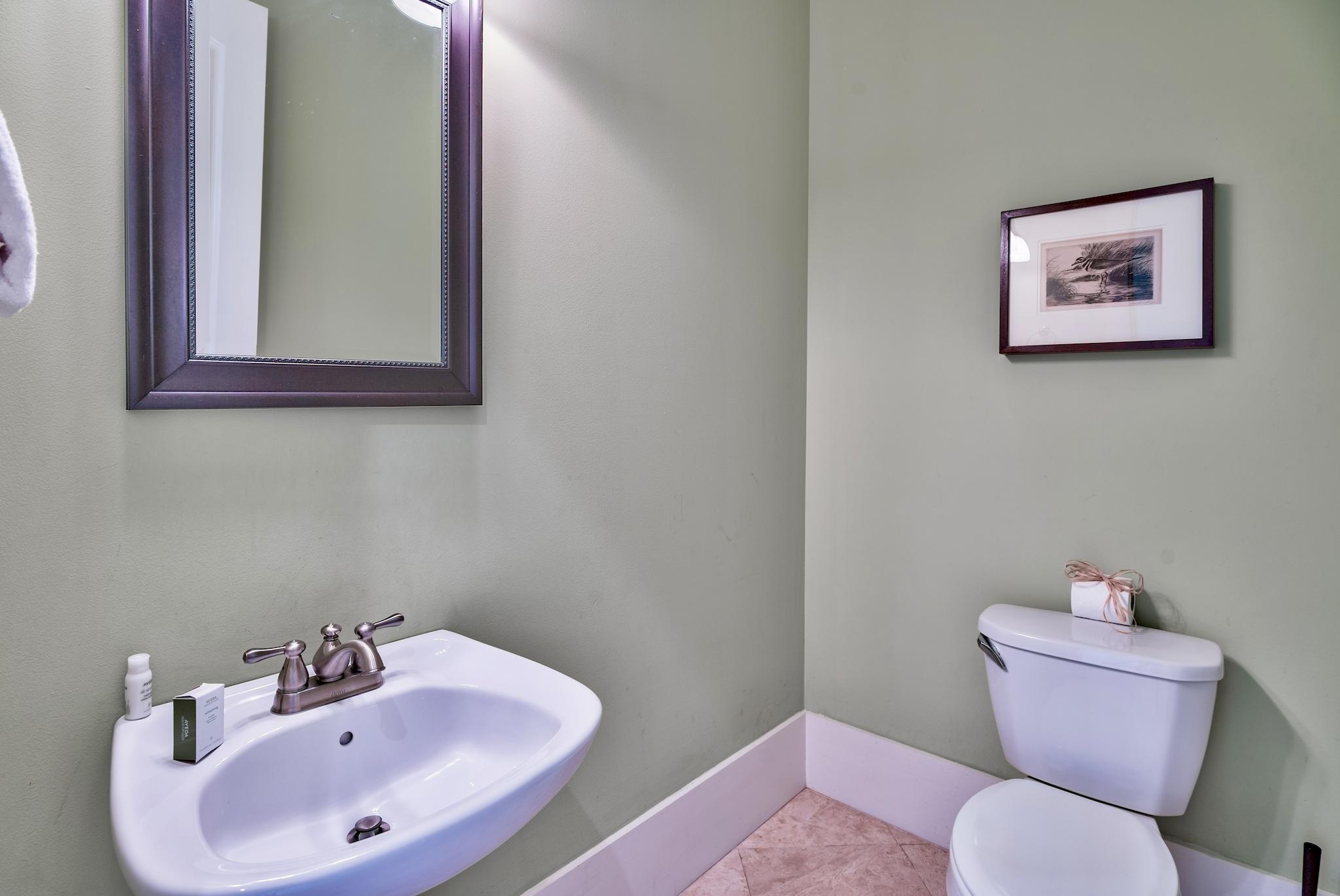 8045 East County Highway 30A Inlet Beach, FL 32461 - Photo 35 of 38 a bathroom with a toilet sink and mirror