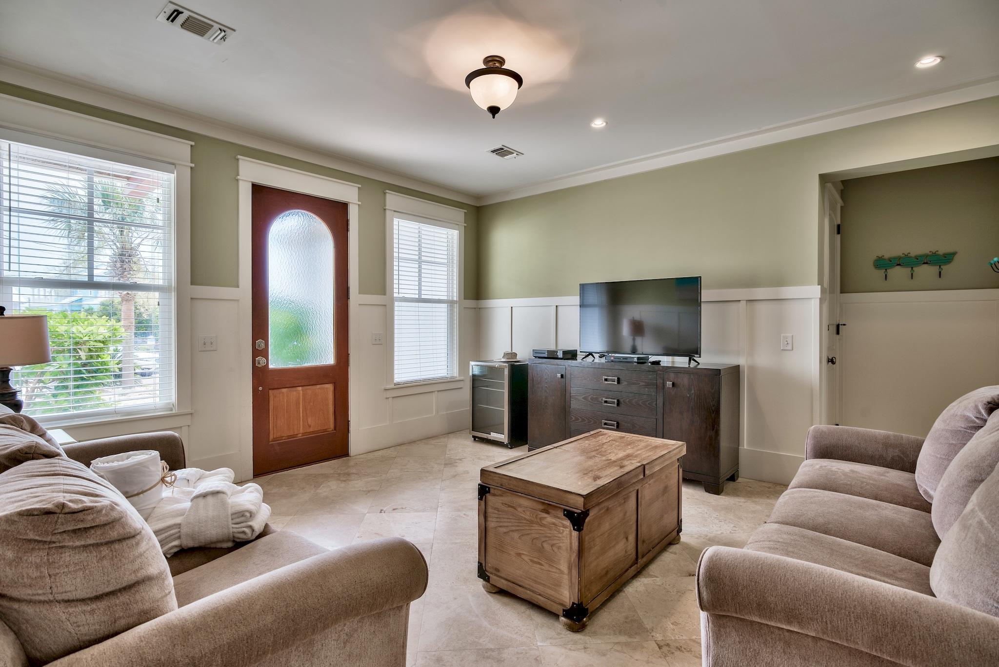 8045 East County Highway 30A Inlet Beach, FL 32461 - Photo 5 of 38 a living room with furniture ceiling fan and a window