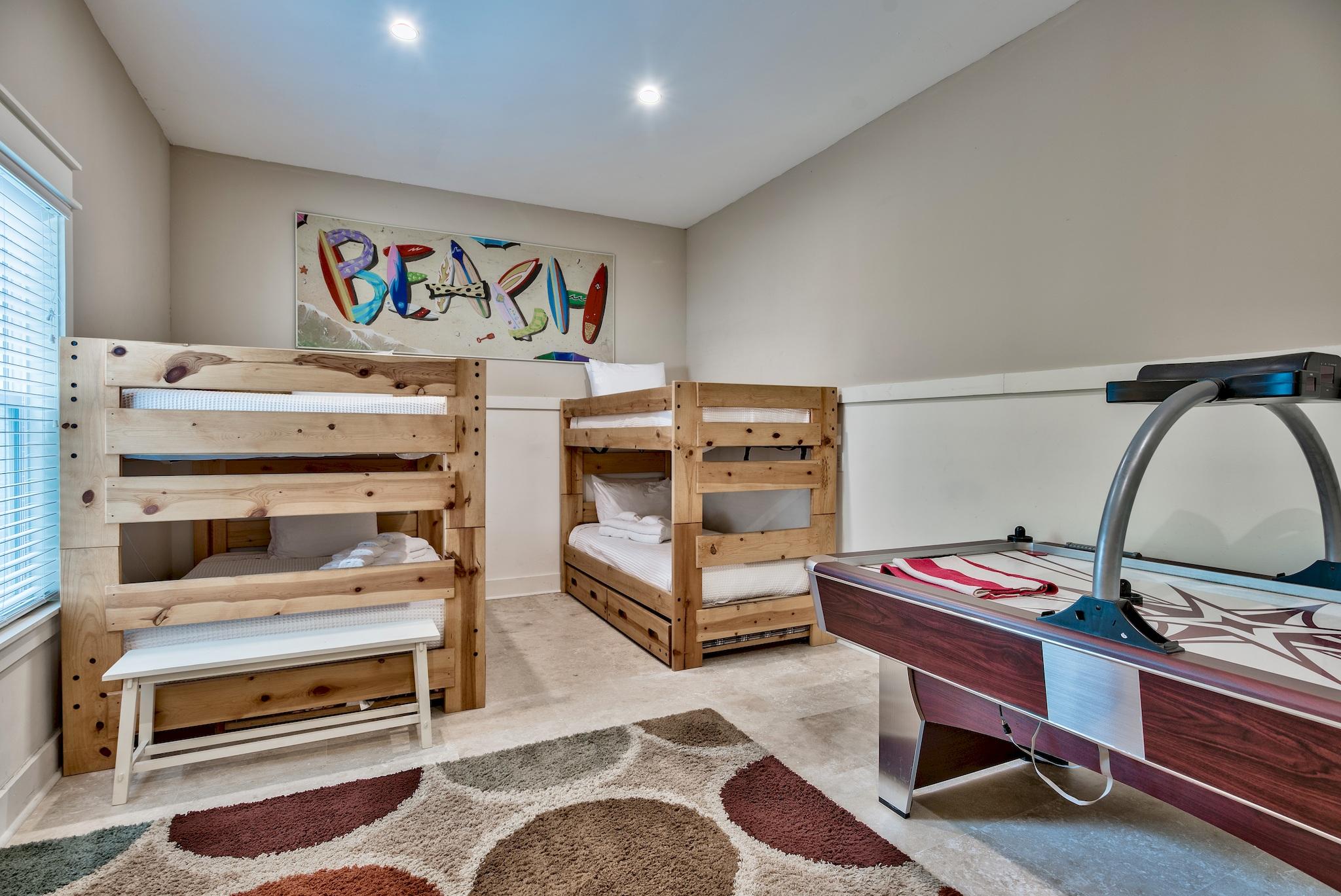 8045 East County Highway 30A Inlet Beach, FL 32461 - Photo 6 of 38 a bedroom with furniture and a wooden floor