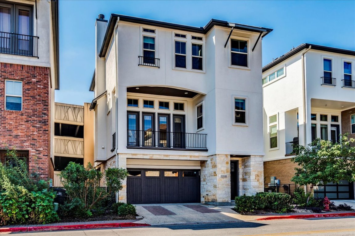 a front view of residential houses with street
