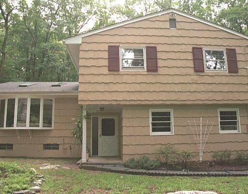 308 Red Fox Road Stamford, CT 06903 - Photo 1 of 1 a front view of a house with a yard