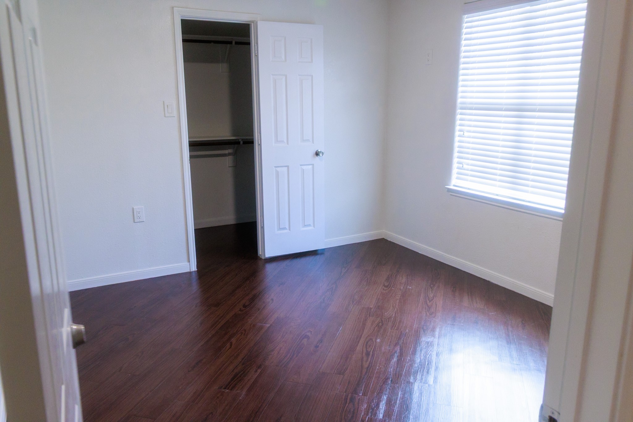 14334 Texarkana Street Houston, TX 77015 - Photo 16 of 26 an empty room with wooden floor and window