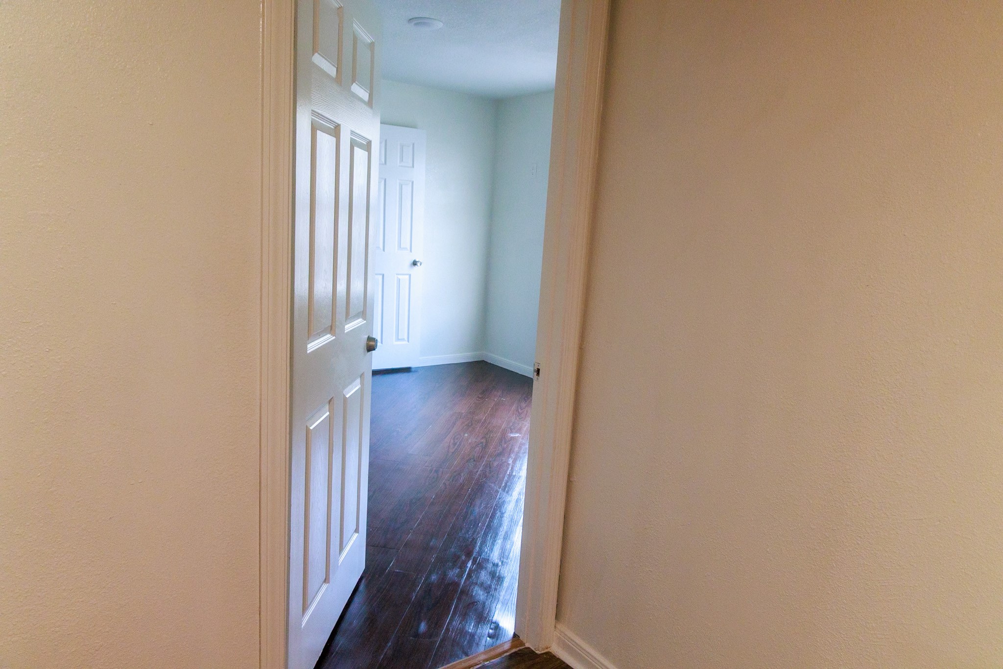 14334 Texarkana Street Houston, TX 77015 - Photo 19 of 26 a view of a hallway with wooden floor