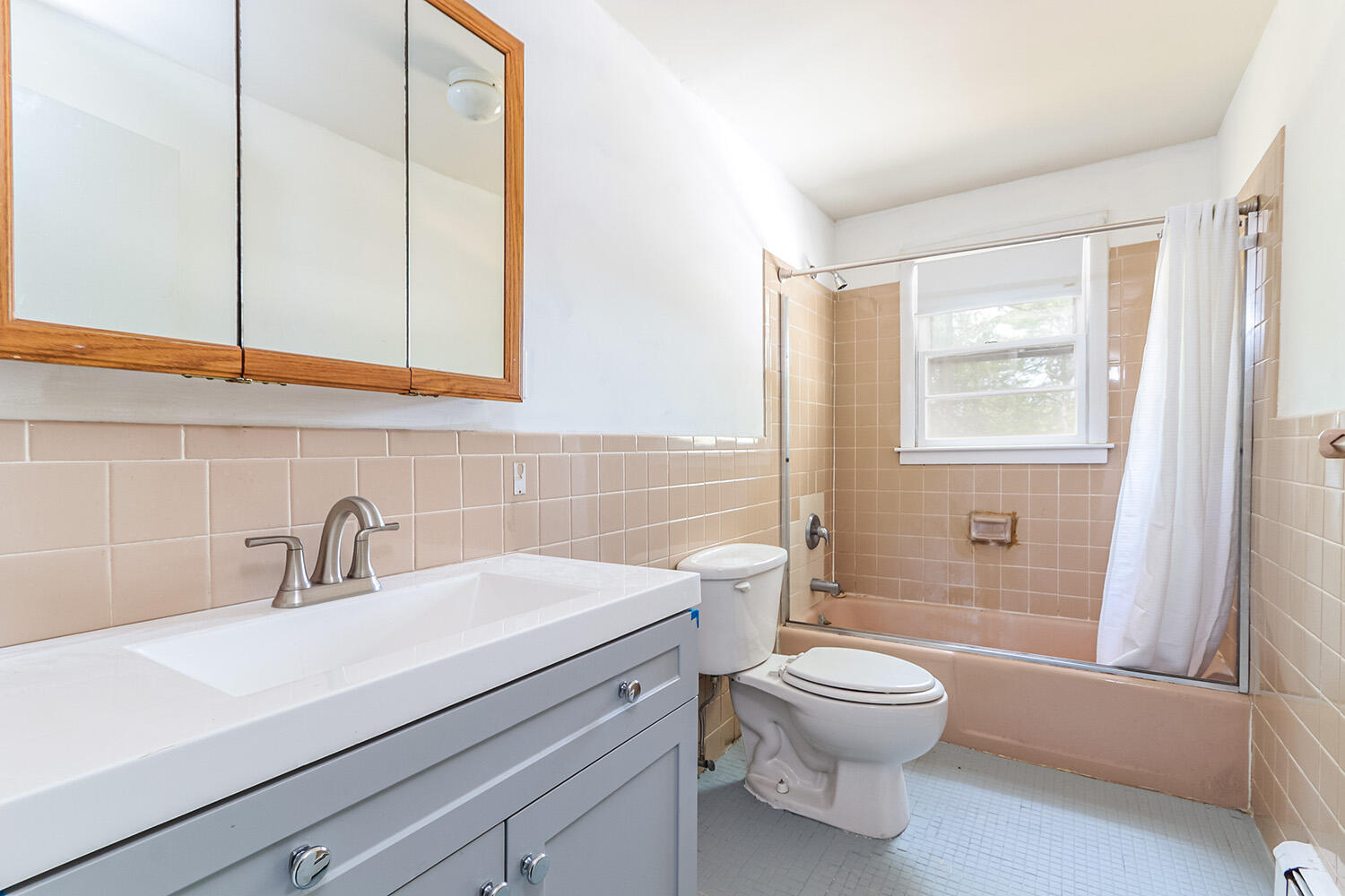 882 Bumps River Road Centerville, MA 02632 - Photo 14 of 23 a bathroom with a sink a toilet and a large mirror