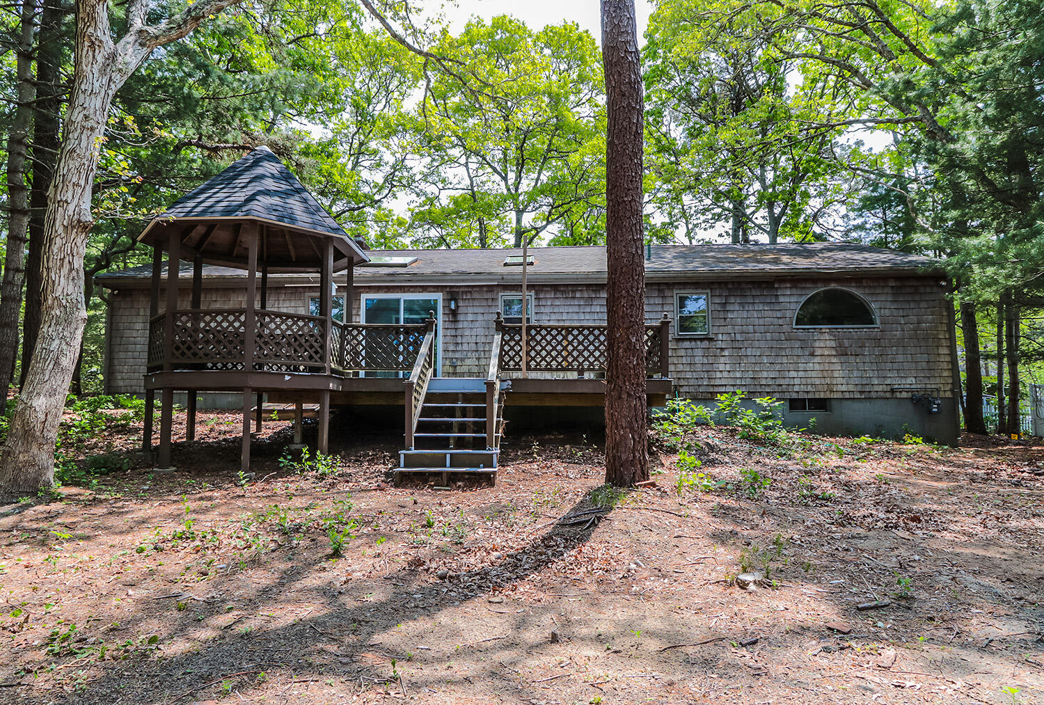 882 Bumps River Road Centerville, MA 02632 - Photo 20 of 23 a front view of a house with garden