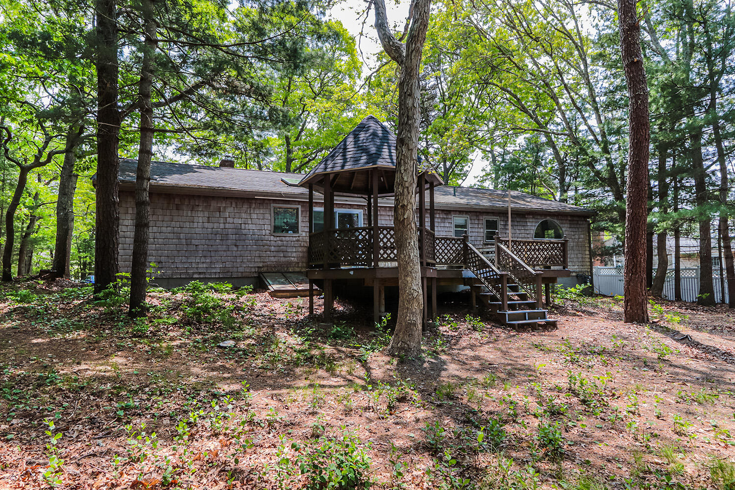 882 Bumps River Road Centerville, MA 02632 - Photo 21 of 23 a view of house with a outdoor seating