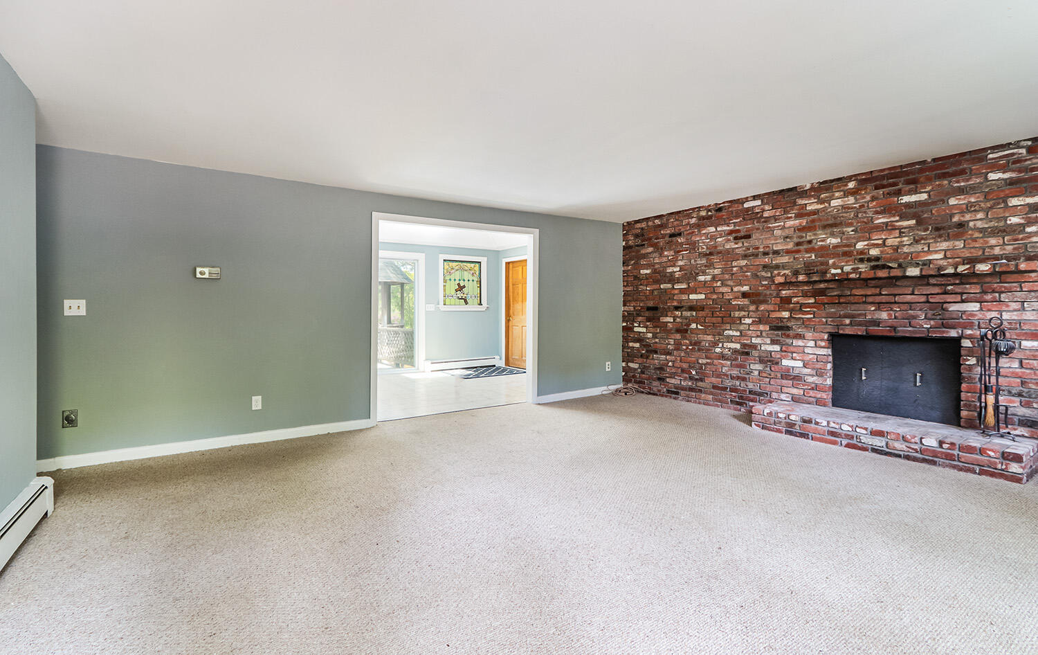 882 Bumps River Road Centerville, MA 02632 - Photo 6 of 23 a view of an empty room with a fireplace