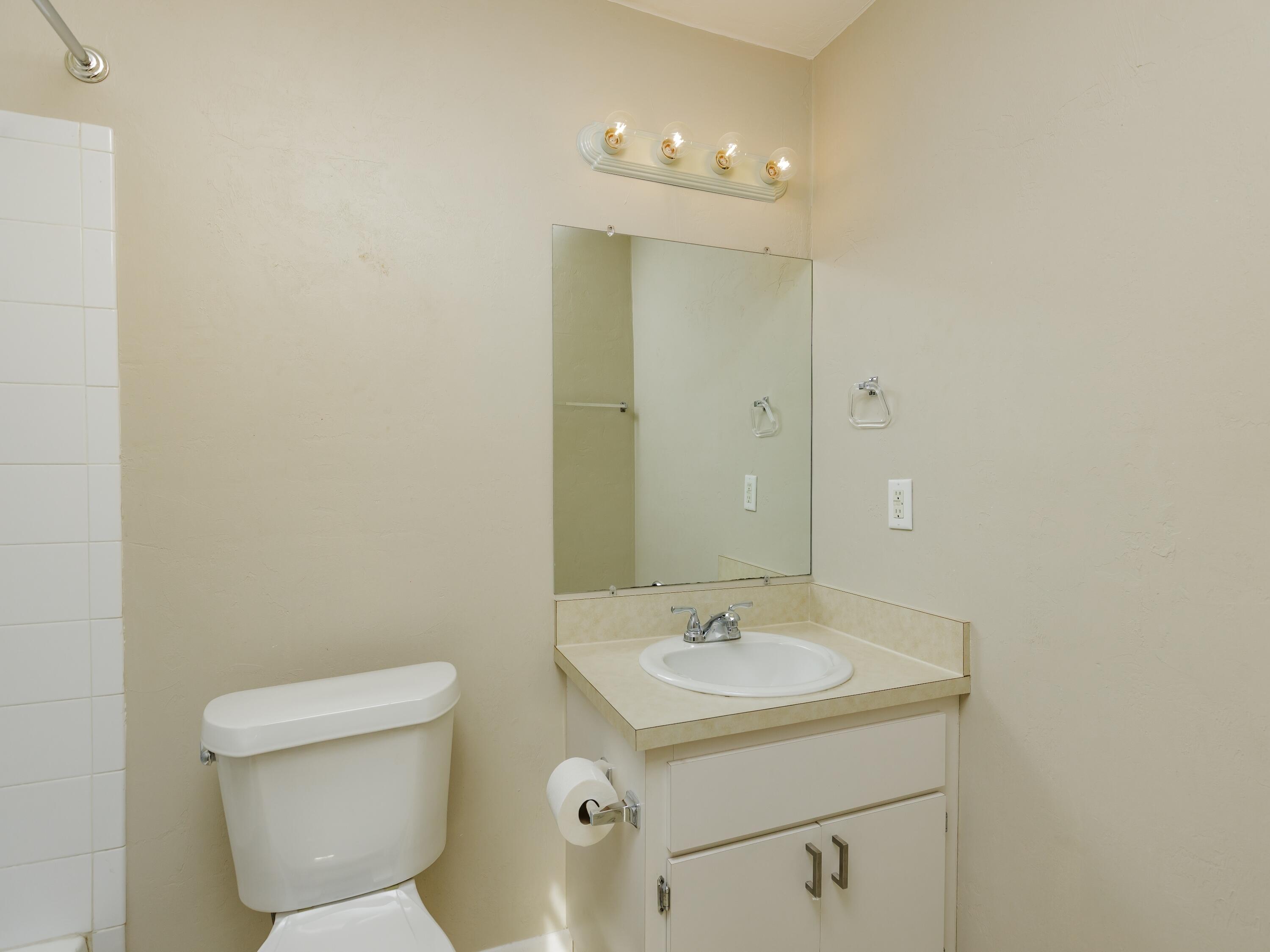 6367 Northwest 109th Place Alachua, FL 32615 - Photo 6 of 15 a bathroom with a sink a toilet and shower