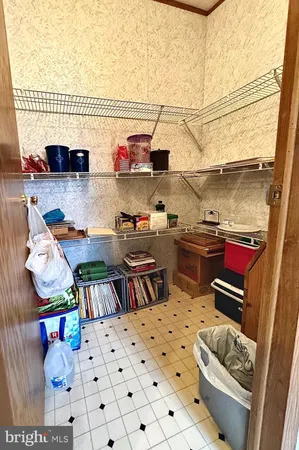 a kitchen with granite countertop a cabinets a sink and a stove top oven