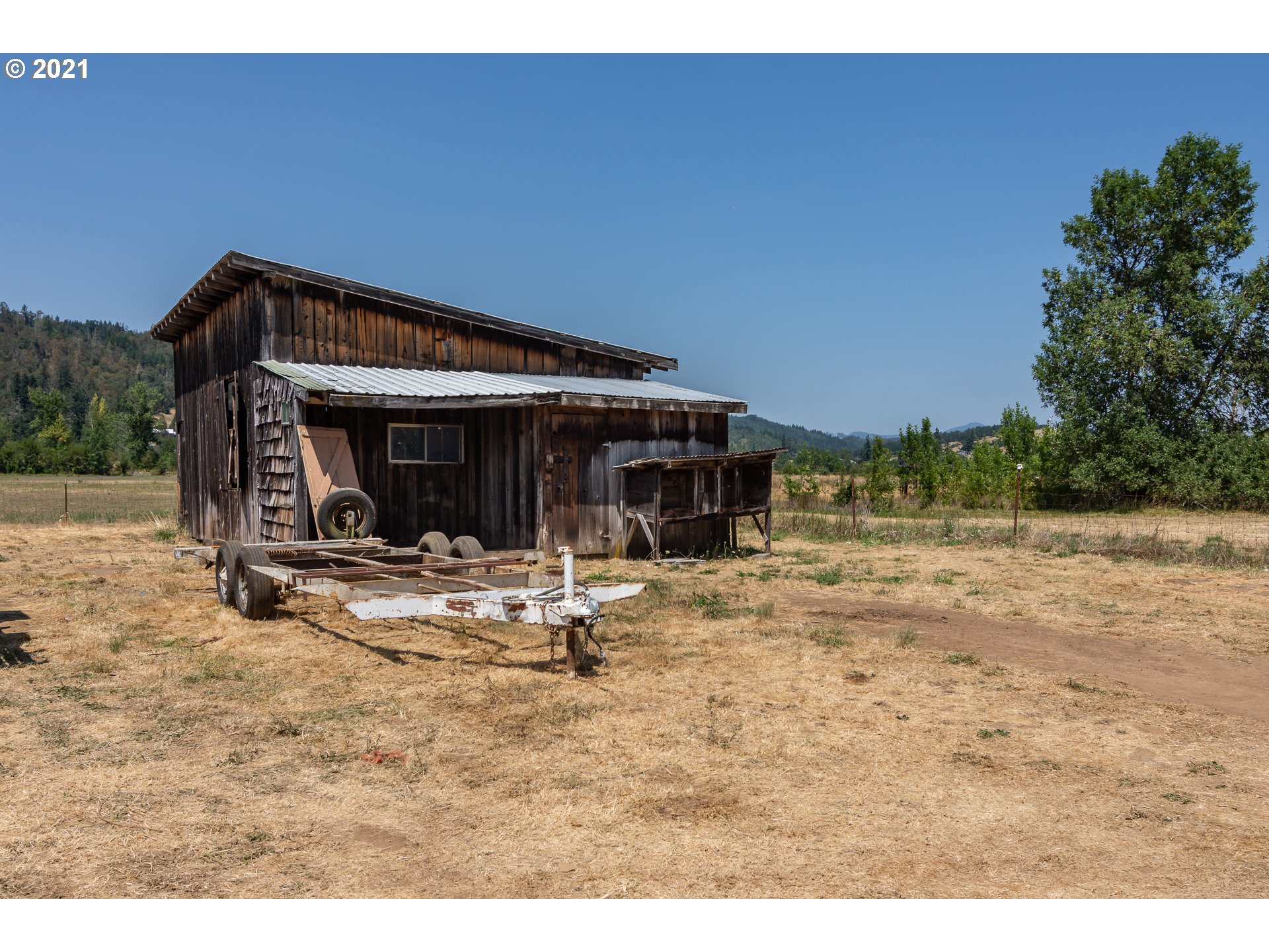 4200 Nonpareil Road Sutherlin, OR 97479 - Photo 27 of 32 a view of a house with backyard
