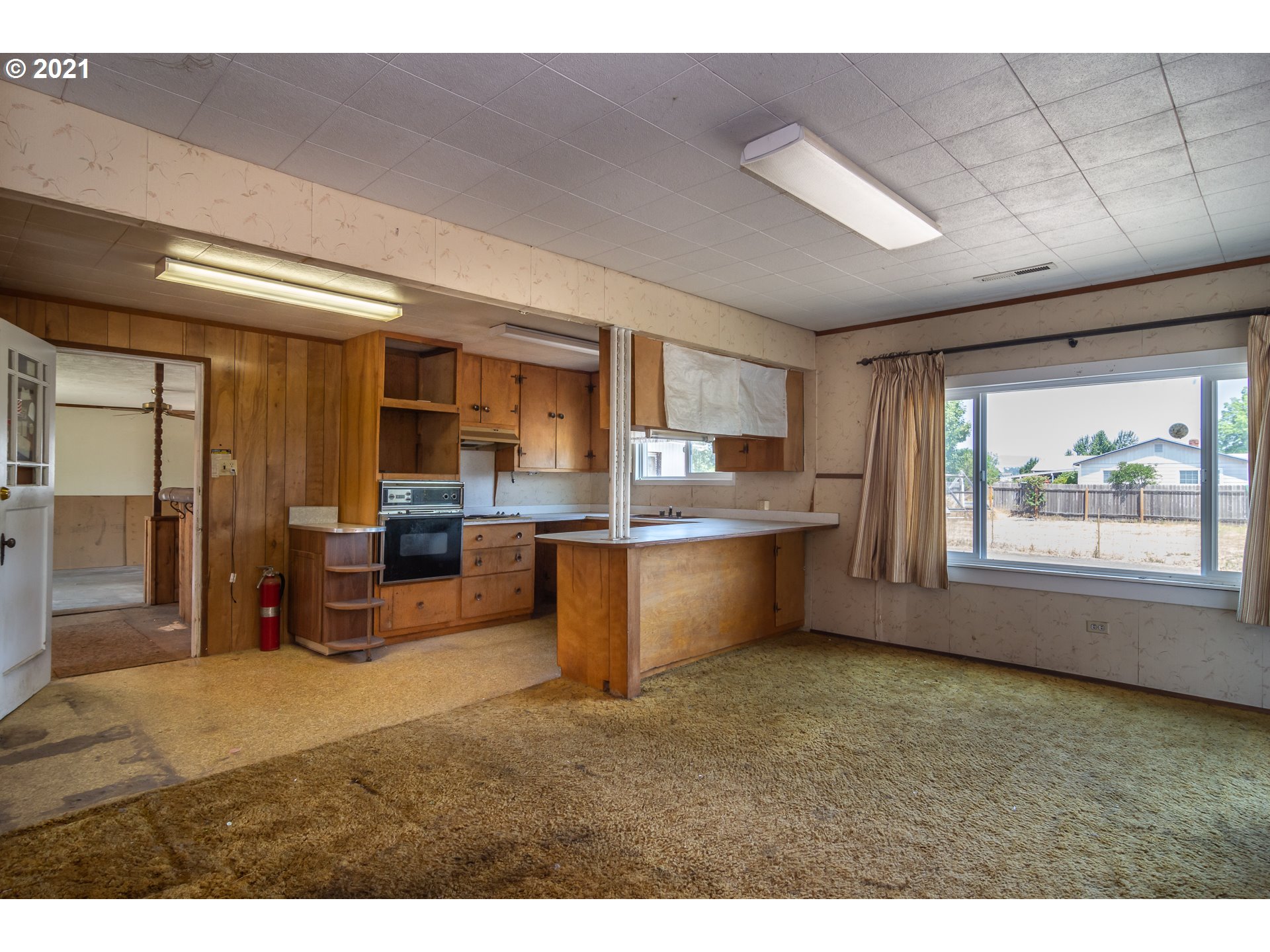 4200 Nonpareil Road Sutherlin, OR 97479 - Photo 9 of 32 a kitchen with stainless steel appliances granite countertop a refrigerator a sink dishwasher a stove with wooden cabinets