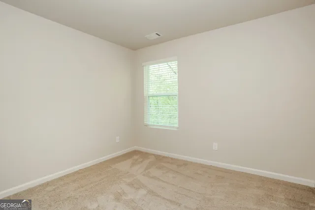 a bathroom with a shower and a sink