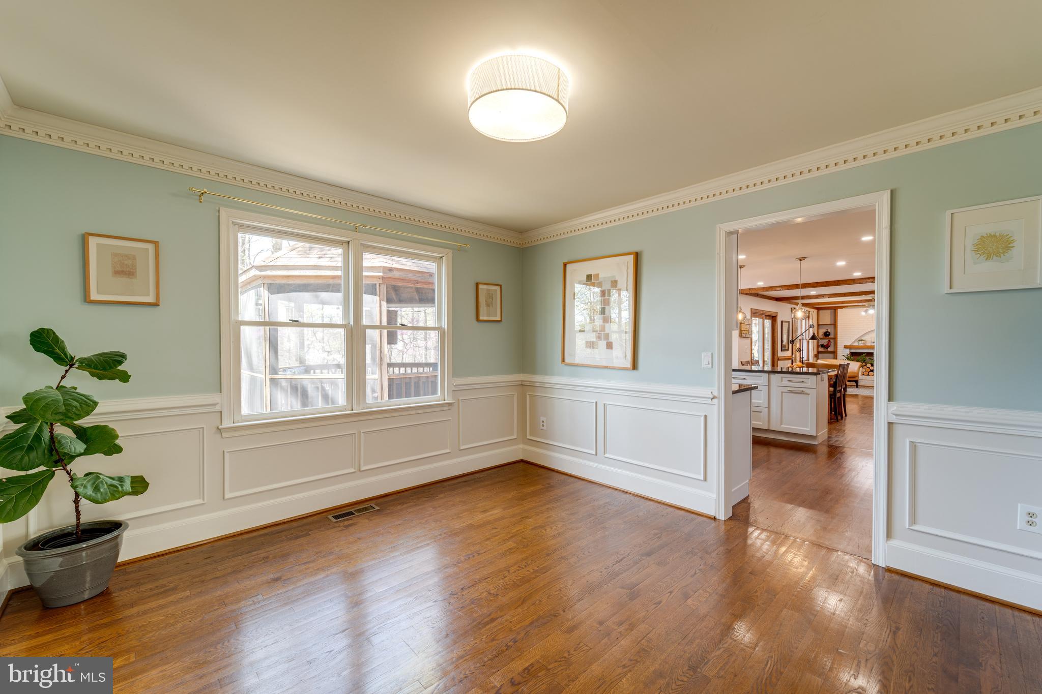 8232 Honeysuckle Road Manassas, VA 20112 - Photo 11 of 76 a view of empty room with wooden floor and fan