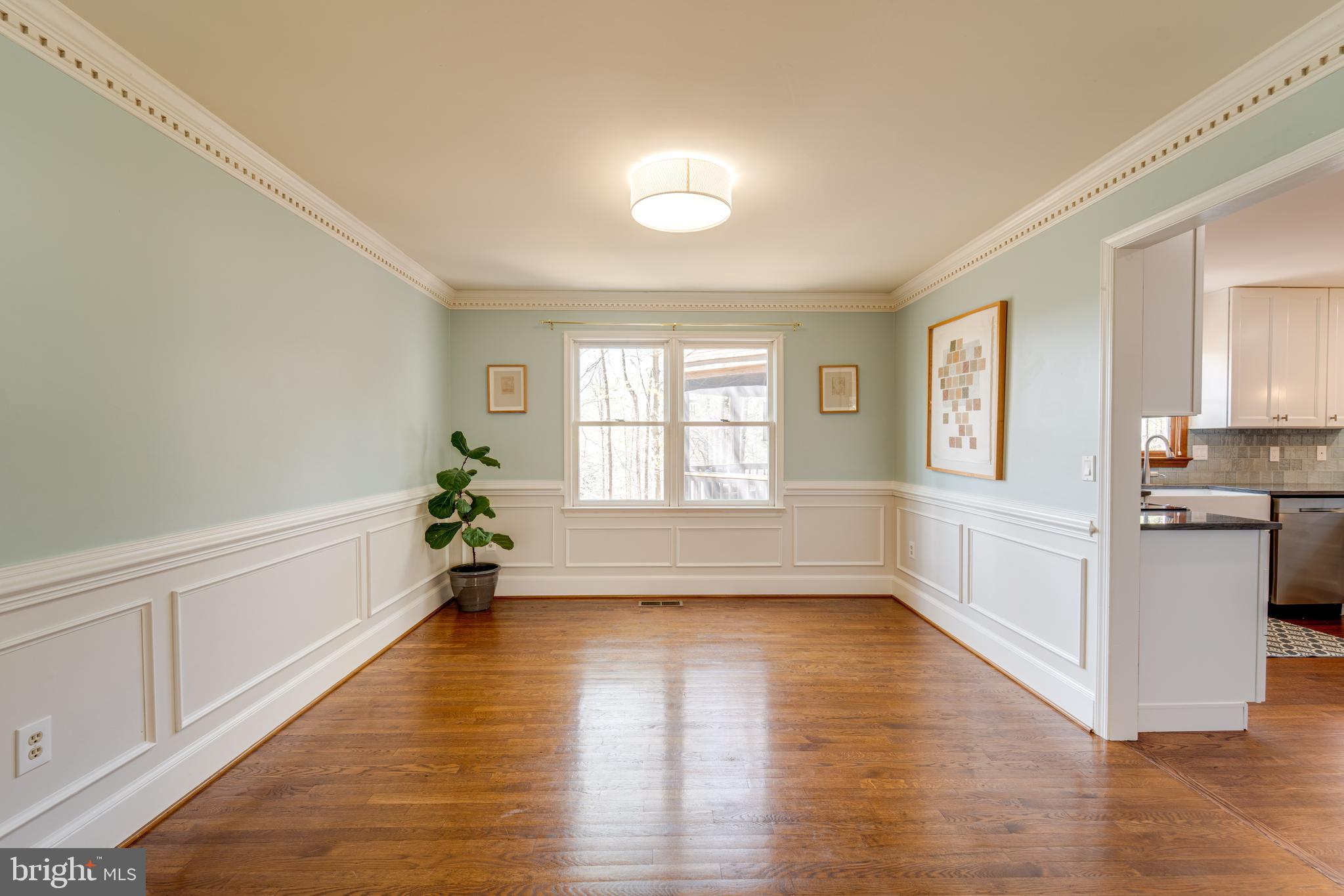 8232 Honeysuckle Road Manassas, VA 20112 - Photo 12 of 76 a large space with a window and wooden floor
