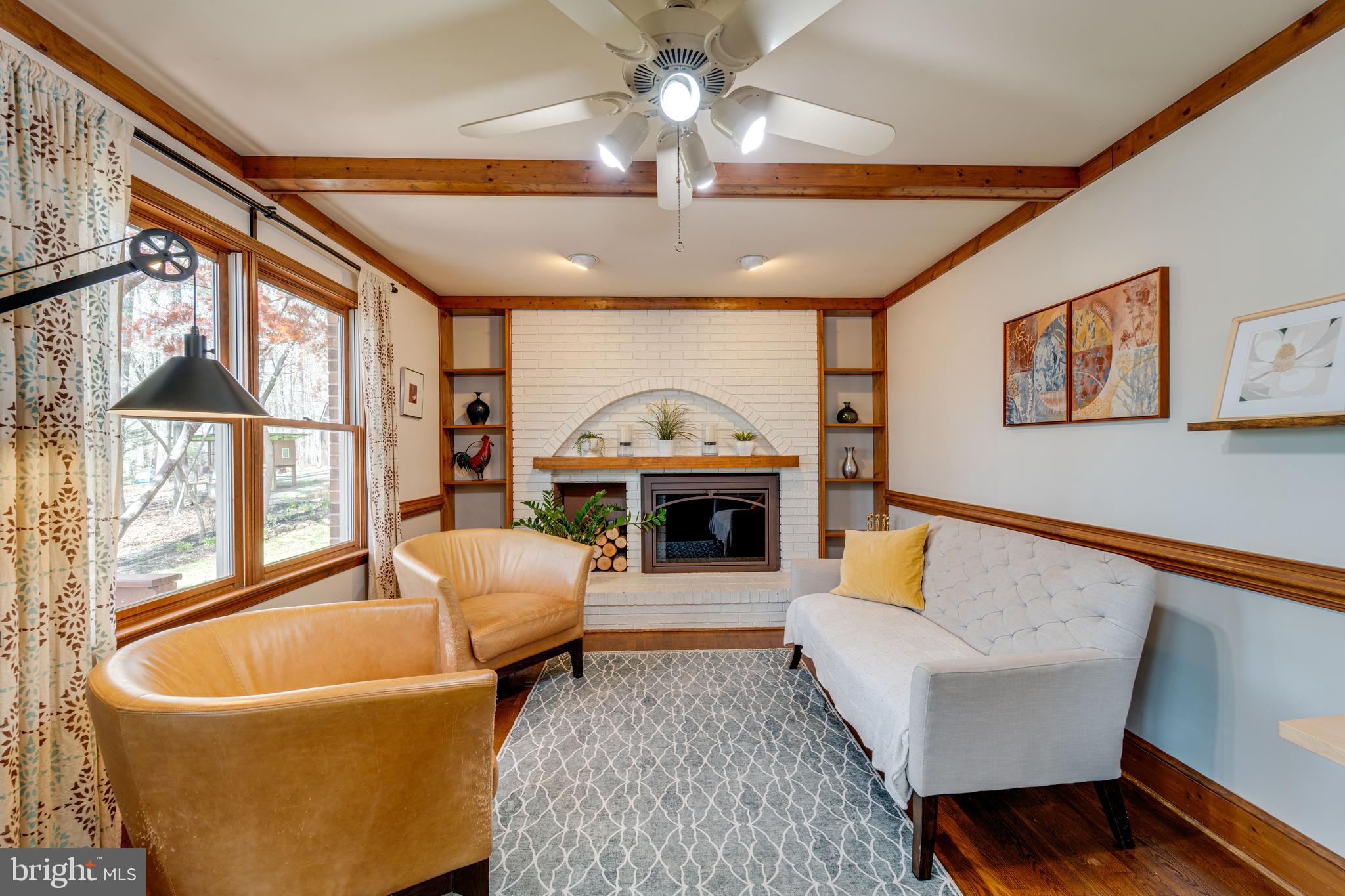 8232 Honeysuckle Road Manassas, VA 20112 - Photo 13 of 76 a living room with furniture and a fireplace