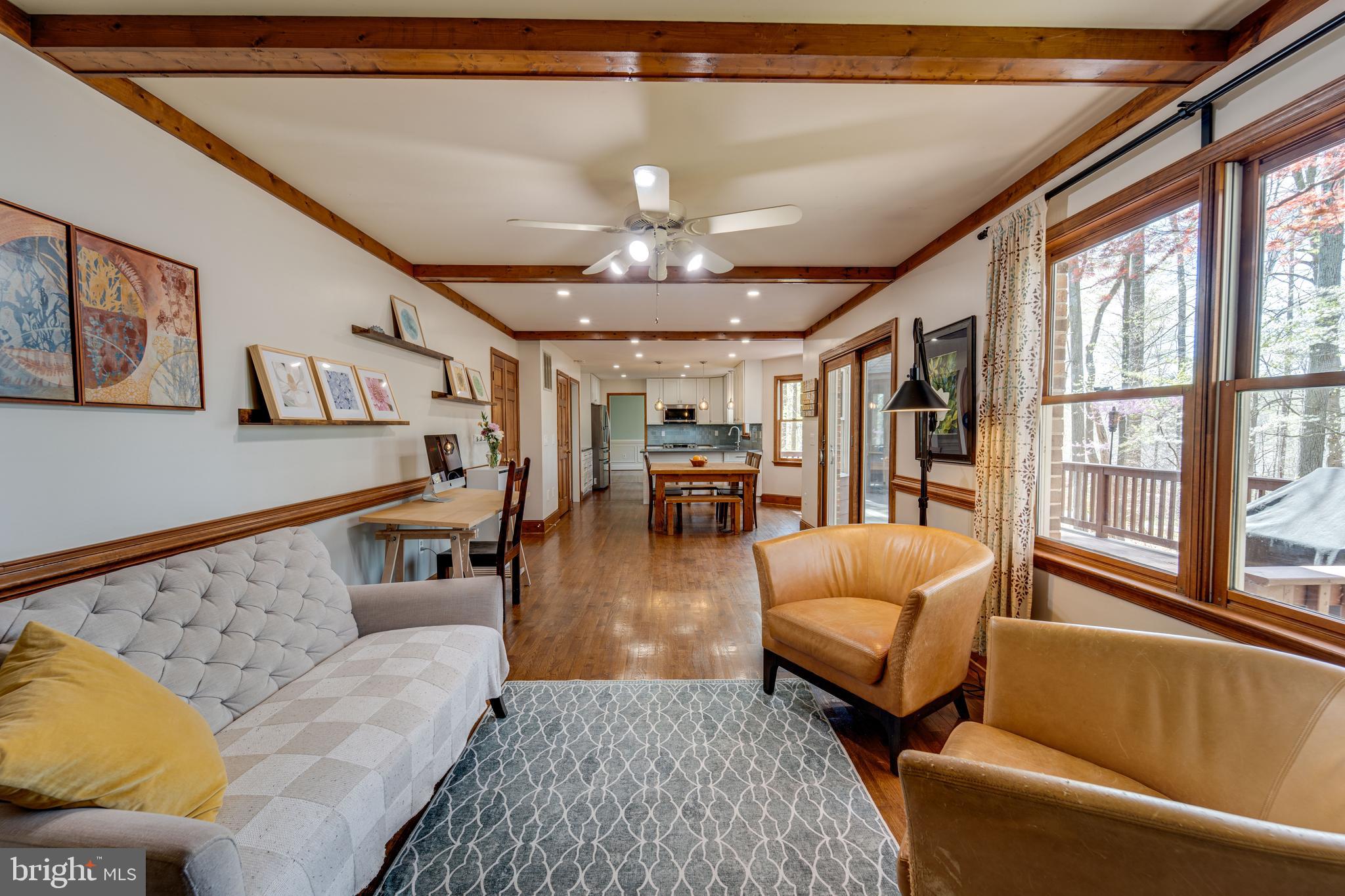 8232 Honeysuckle Road Manassas, VA 20112 - Photo 14 of 76 a living room with furniture and a large window