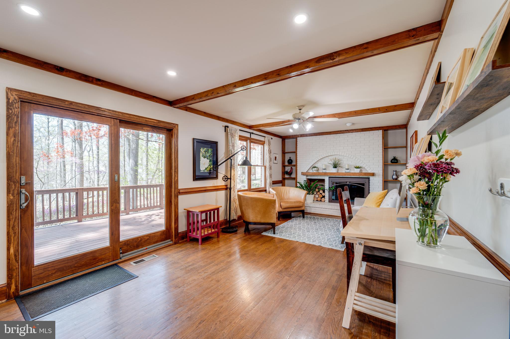 8232 Honeysuckle Road Manassas, VA 20112 - Photo 15 of 76 a living room with furniture and a flat screen tv