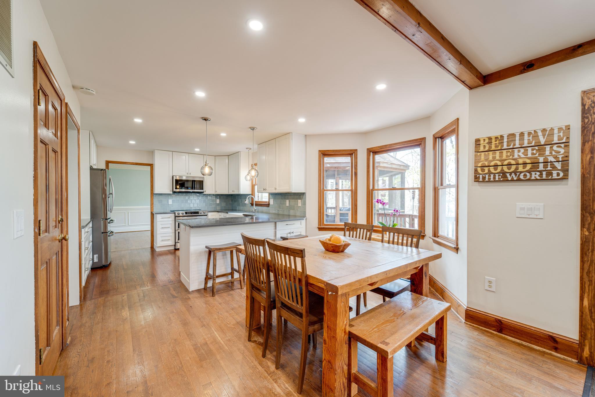 8232 Honeysuckle Road Manassas, VA 20112 - Photo 17 of 76 a view of a dining room with furniture window and wooden floor