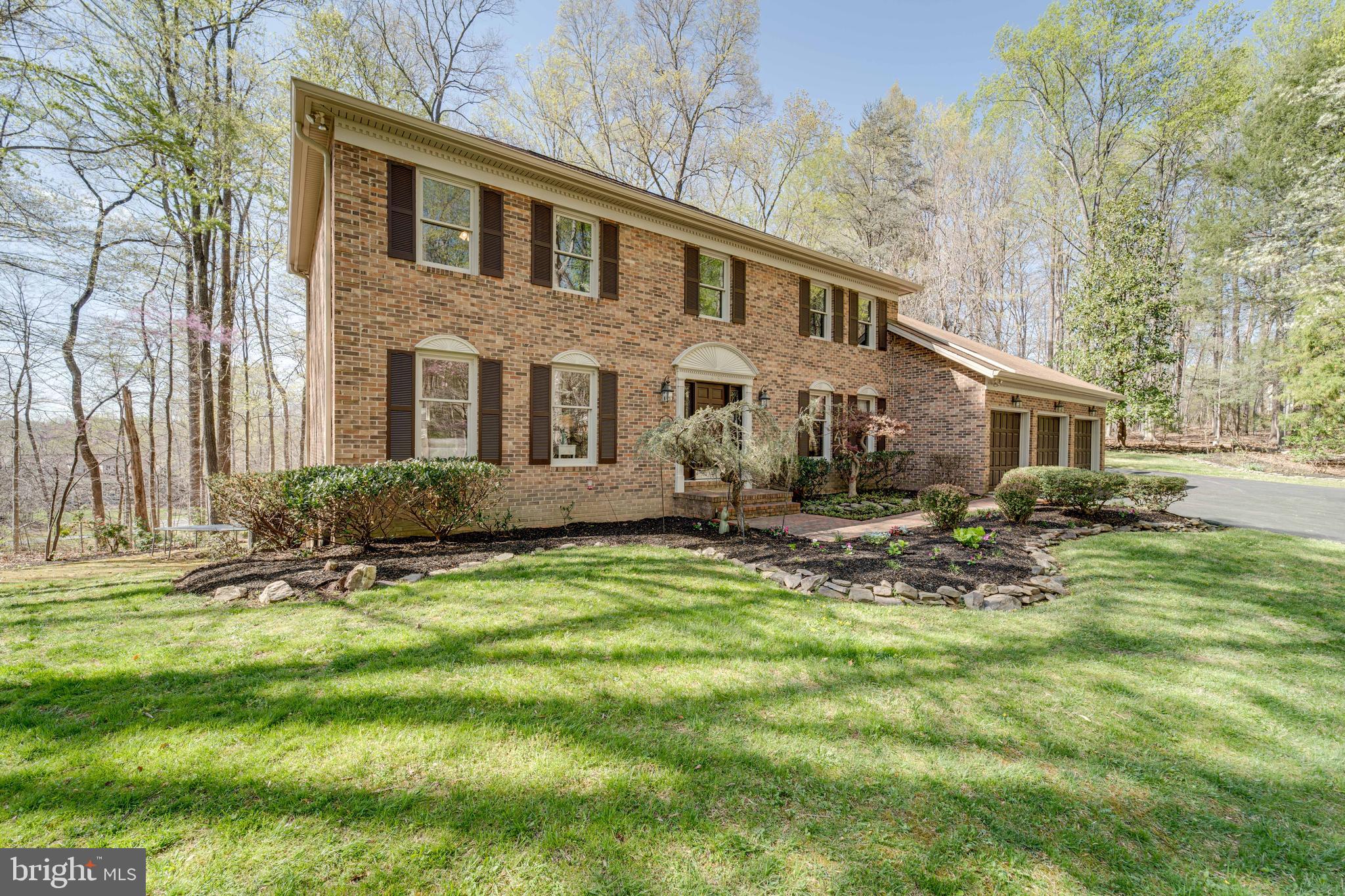 8232 Honeysuckle Road Manassas, VA 20112 - Photo 2 of 76 a view of a house with a yard