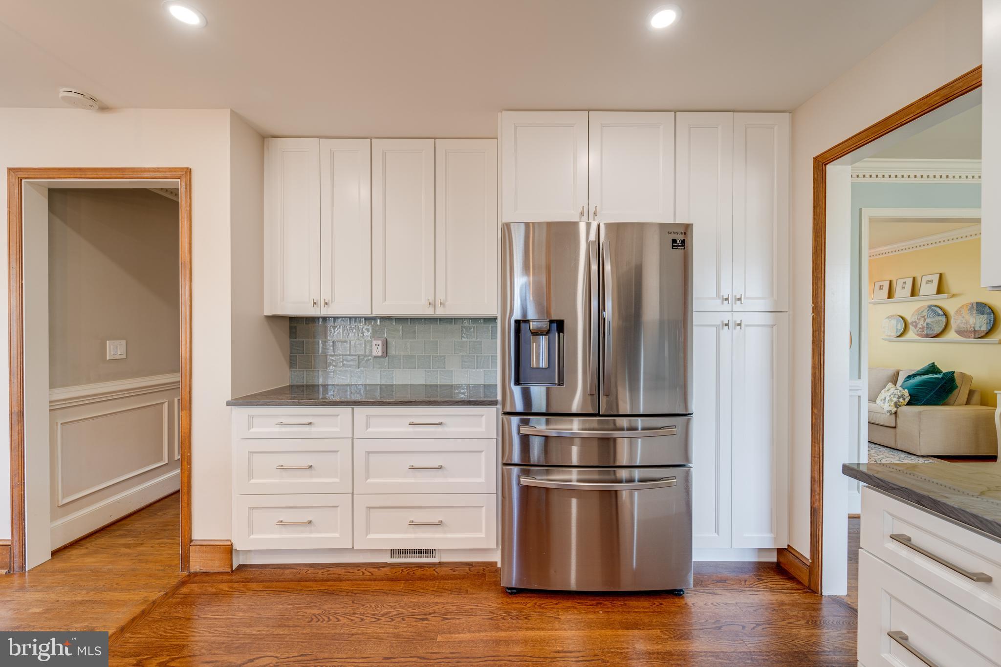 8232 Honeysuckle Road Manassas, VA 20112 - Photo 21 of 76 a kitchen with stainless steel appliances granite countertop a refrigerator and a stove top oven