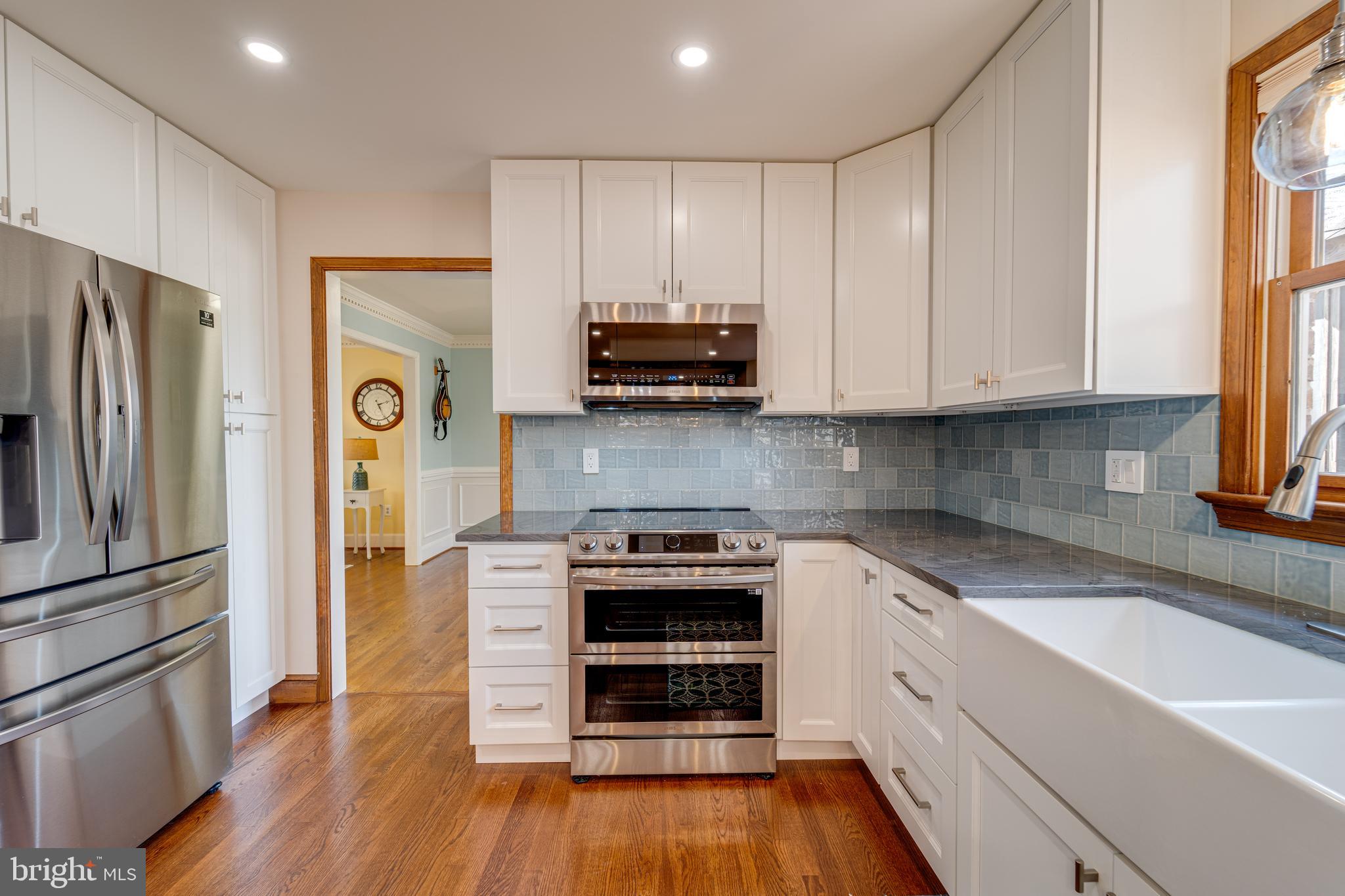 8232 Honeysuckle Road Manassas, VA 20112 - Photo 23 of 76 a kitchen with a refrigerator and a stove