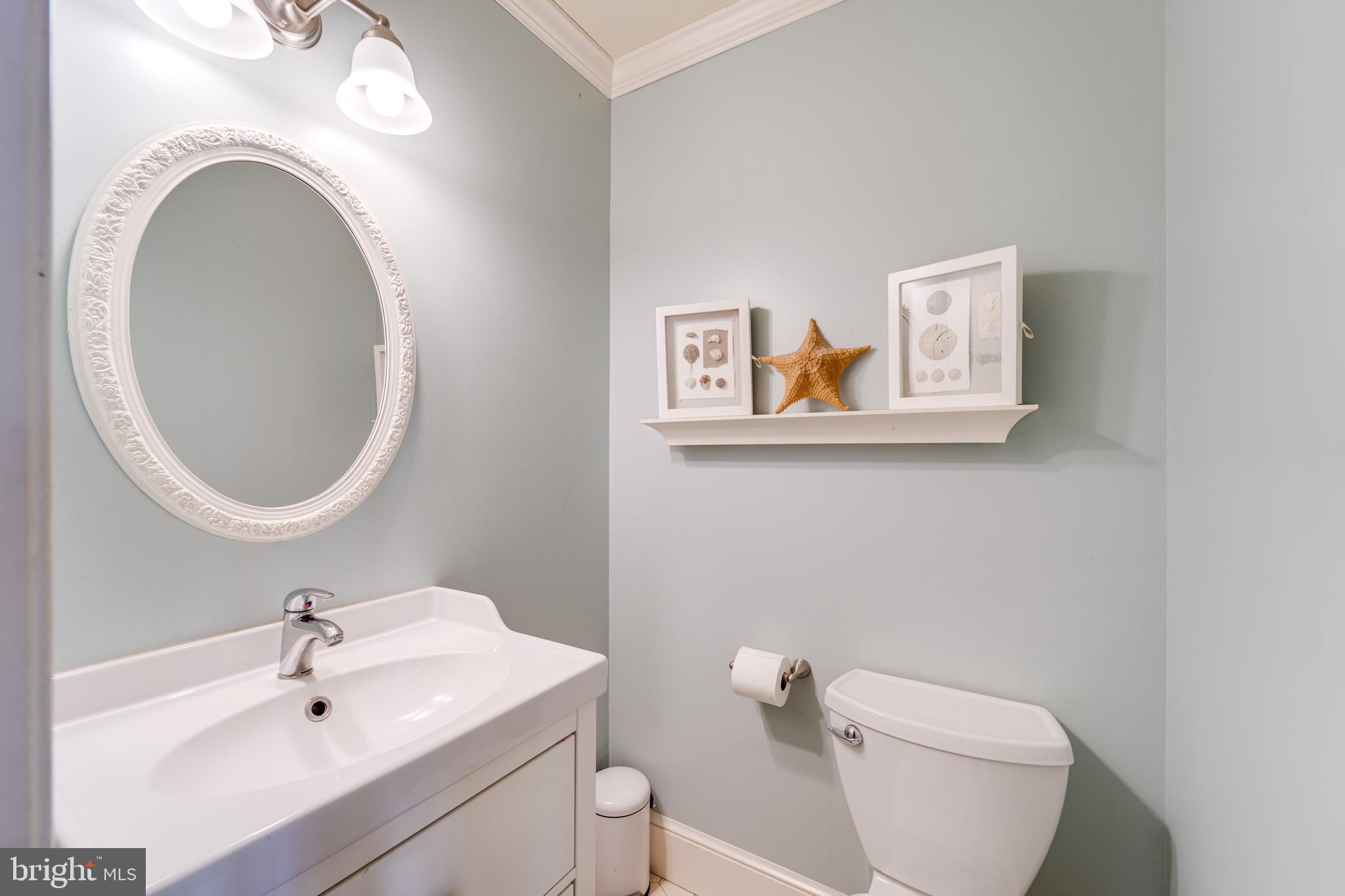 8232 Honeysuckle Road Manassas, VA 20112 - Photo 27 of 76 a bathroom with a toilet a sink and a mirror