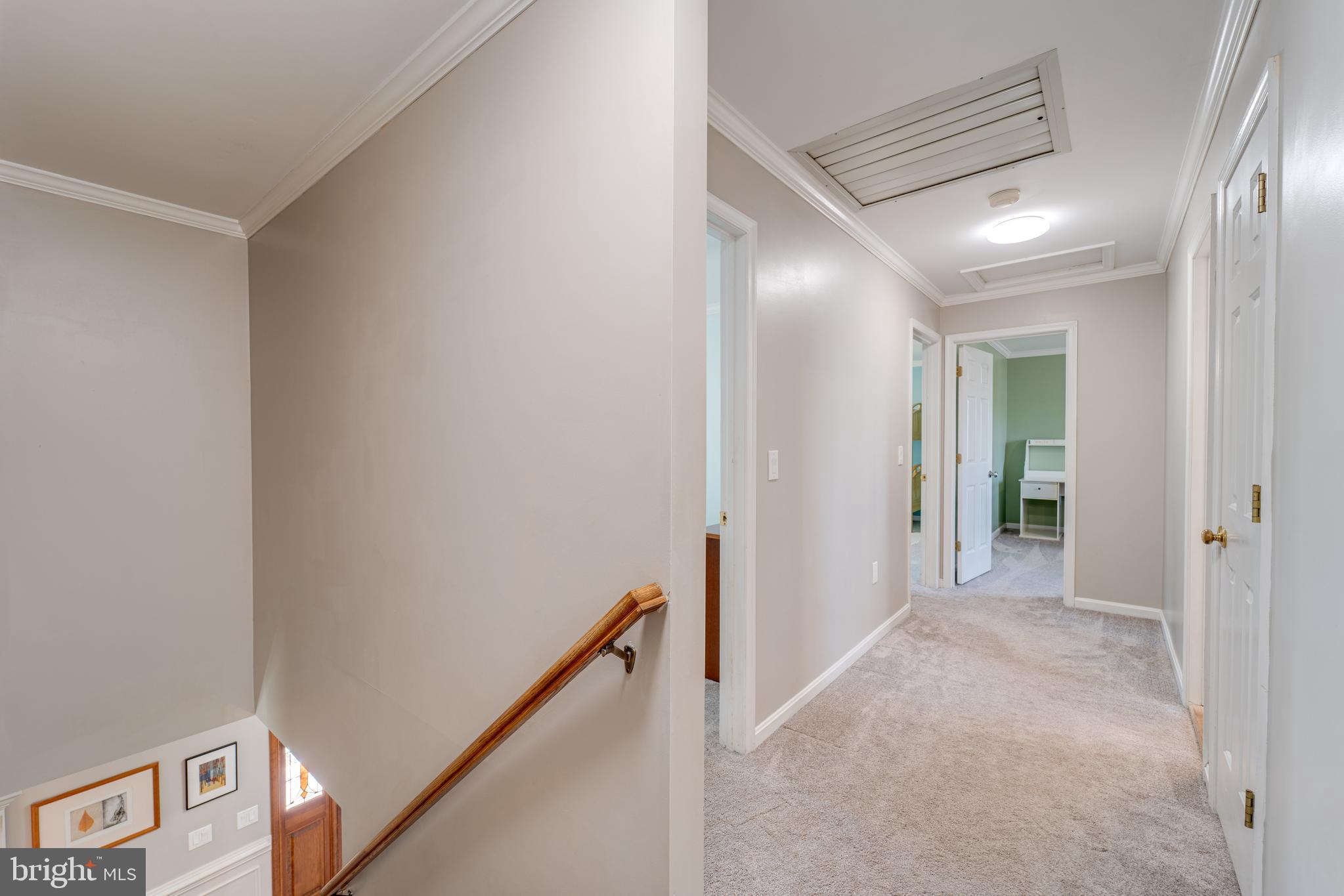 8232 Honeysuckle Road Manassas, VA 20112 - Photo 28 of 76 a view of a hallway with closet and wooden floor