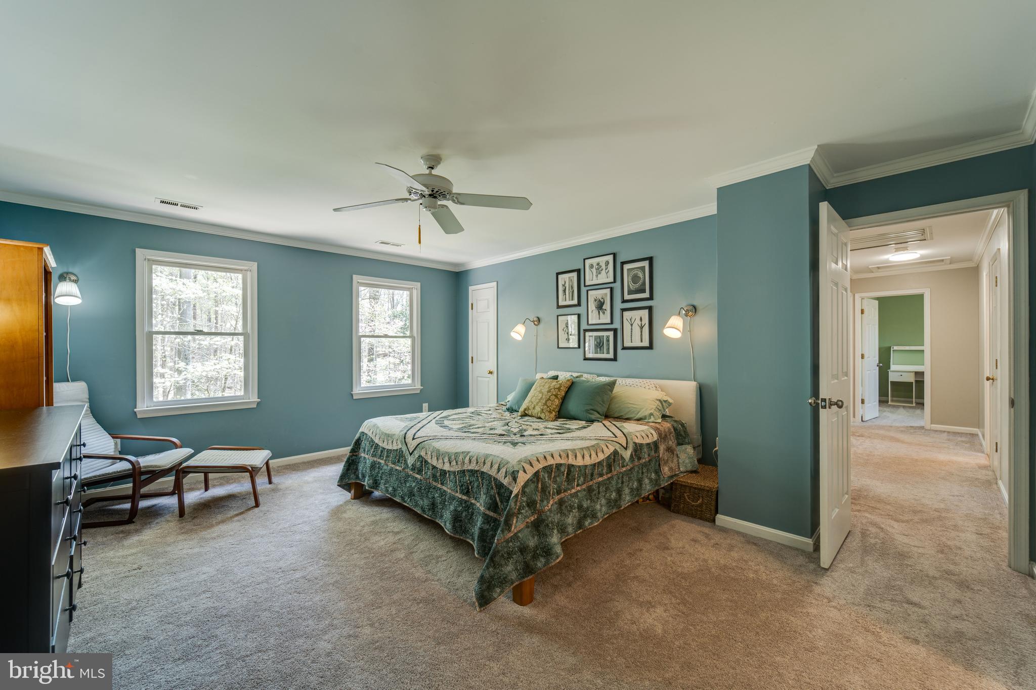 8232 Honeysuckle Road Manassas, VA 20112 - Photo 29 of 76 a bedroom with a bed a table and chair