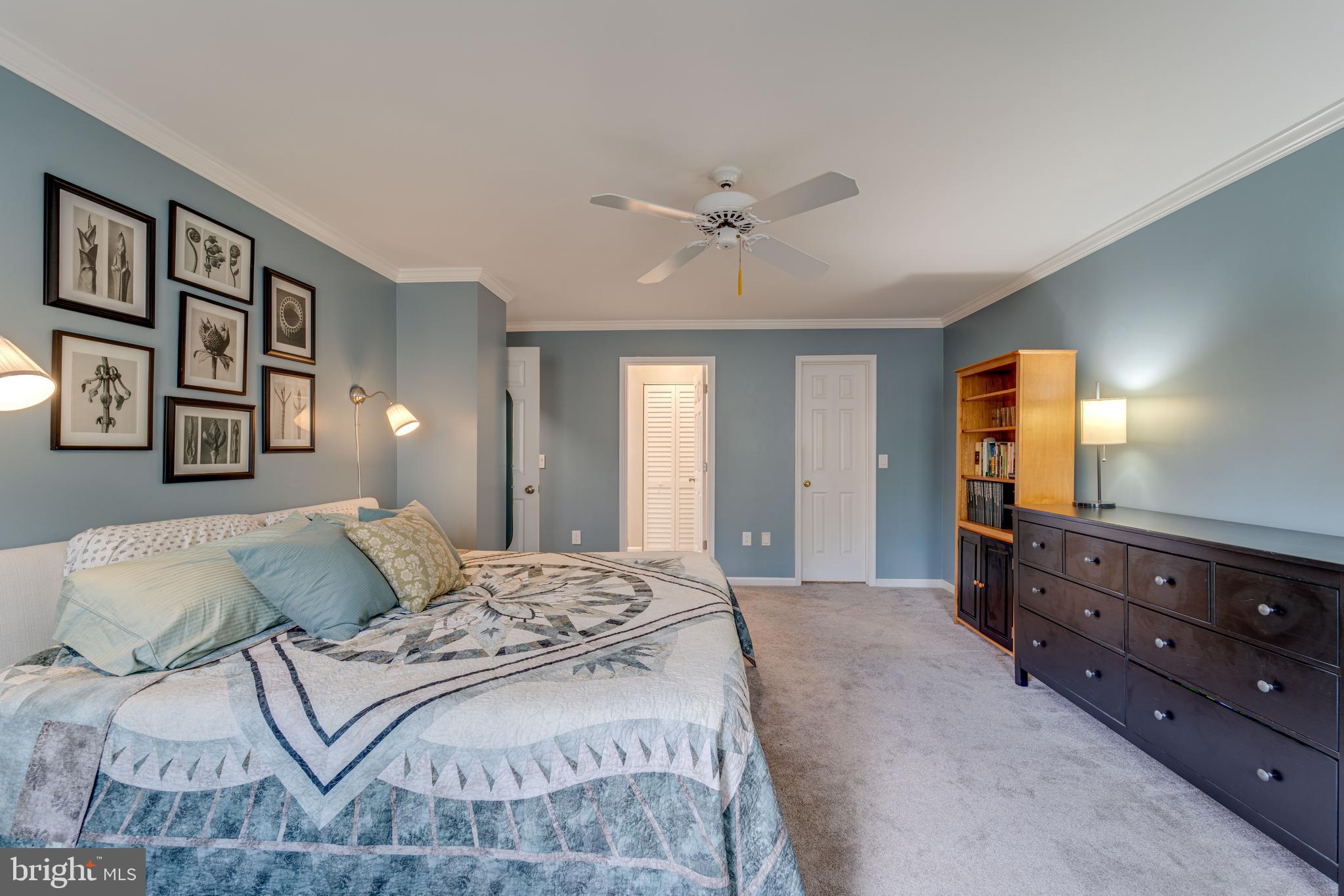8232 Honeysuckle Road Manassas, VA 20112 - Photo 31 of 76 a bedroom with a bed and a mirror on dresser