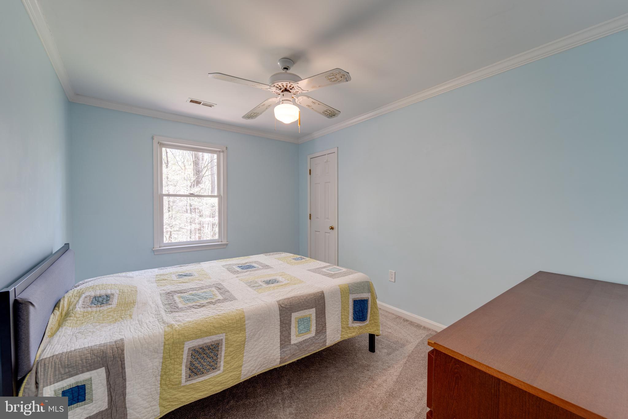 8232 Honeysuckle Road Manassas, VA 20112 - Photo 38 of 76 a utility room with a bed and window