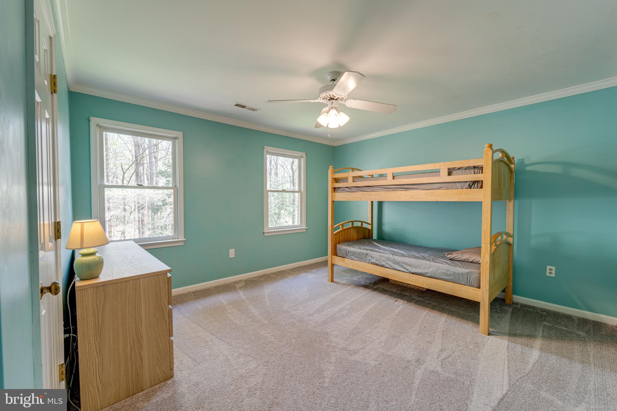 8232 Honeysuckle Road Manassas, VA 20112 - Photo 40 of 76 a bedroom with a bed and a window