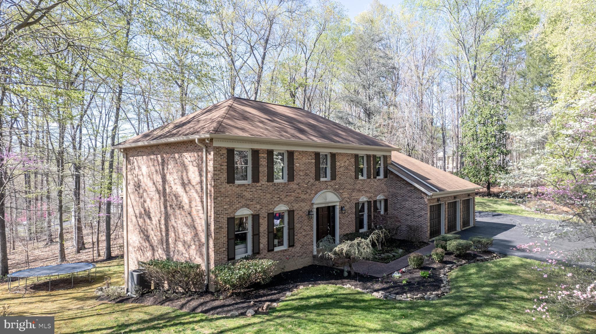 8232 Honeysuckle Road Manassas, VA 20112 - Photo 4 of 76 a front view of a house with a yard garage and outdoor seating