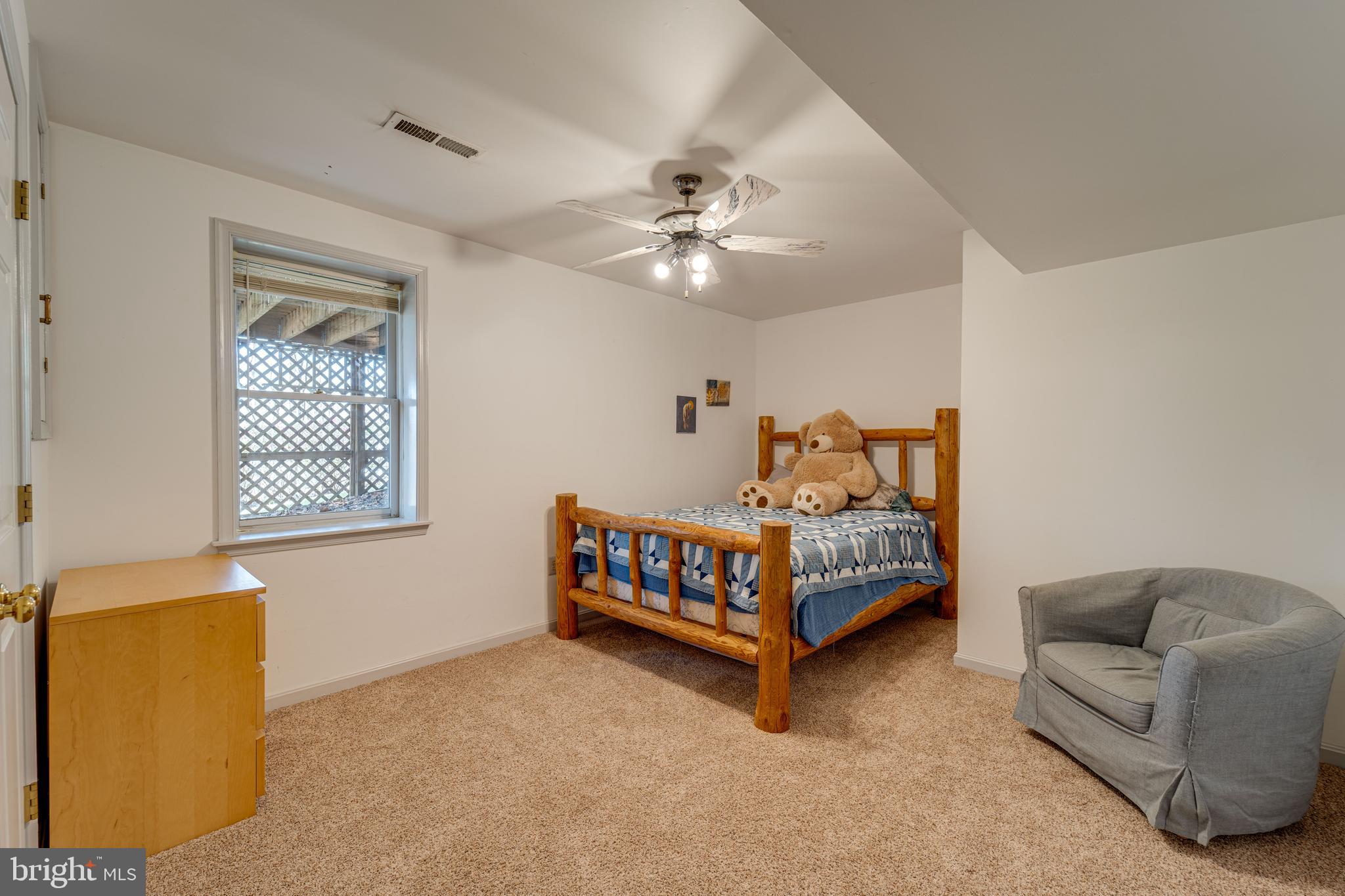 8232 Honeysuckle Road Manassas, VA 20112 - Photo 44 of 76 a bedroom with a bed and a couch