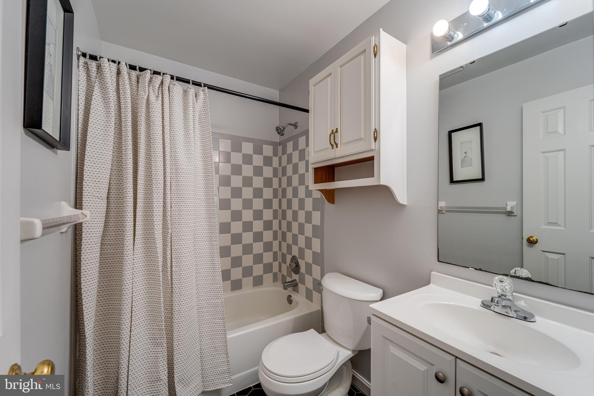 8232 Honeysuckle Road Manassas, VA 20112 - Photo 47 of 76 a bathroom with a sink toilet and shower