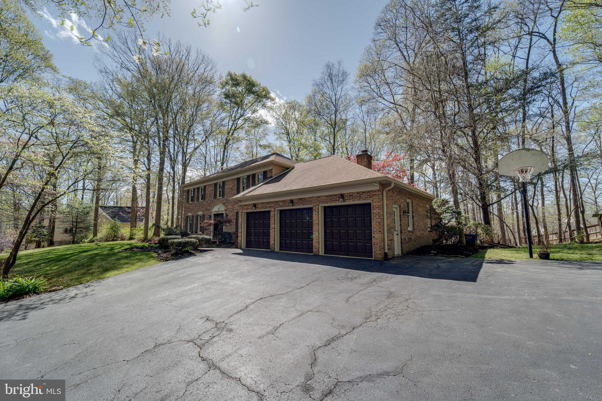 8232 Honeysuckle Road Manassas, VA 20112 - Photo 74 of 76 a view of house with outdoor space and trees