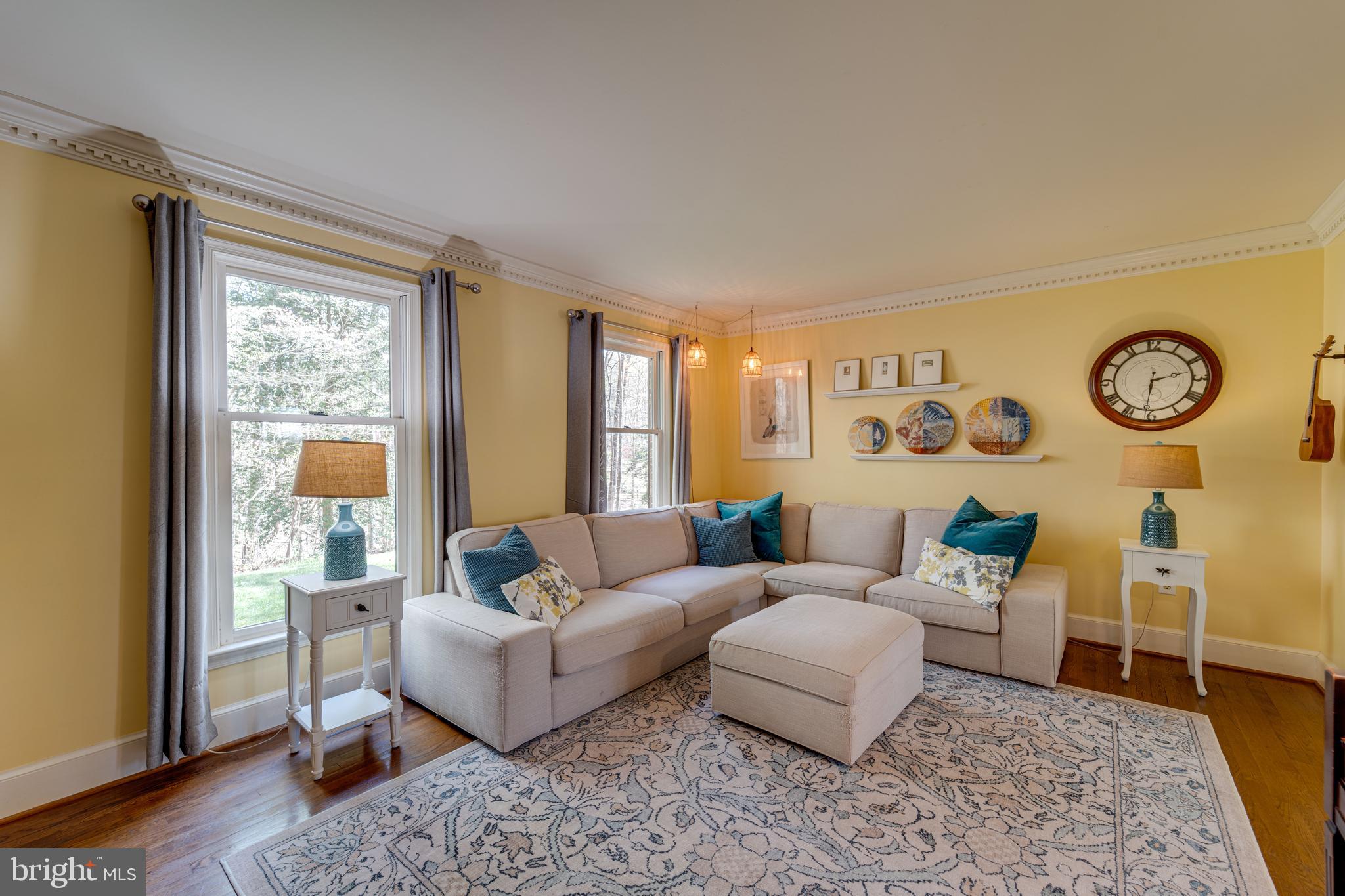 8232 Honeysuckle Road Manassas, VA 20112 - Photo 8 of 76 a living room with furniture and a large window
