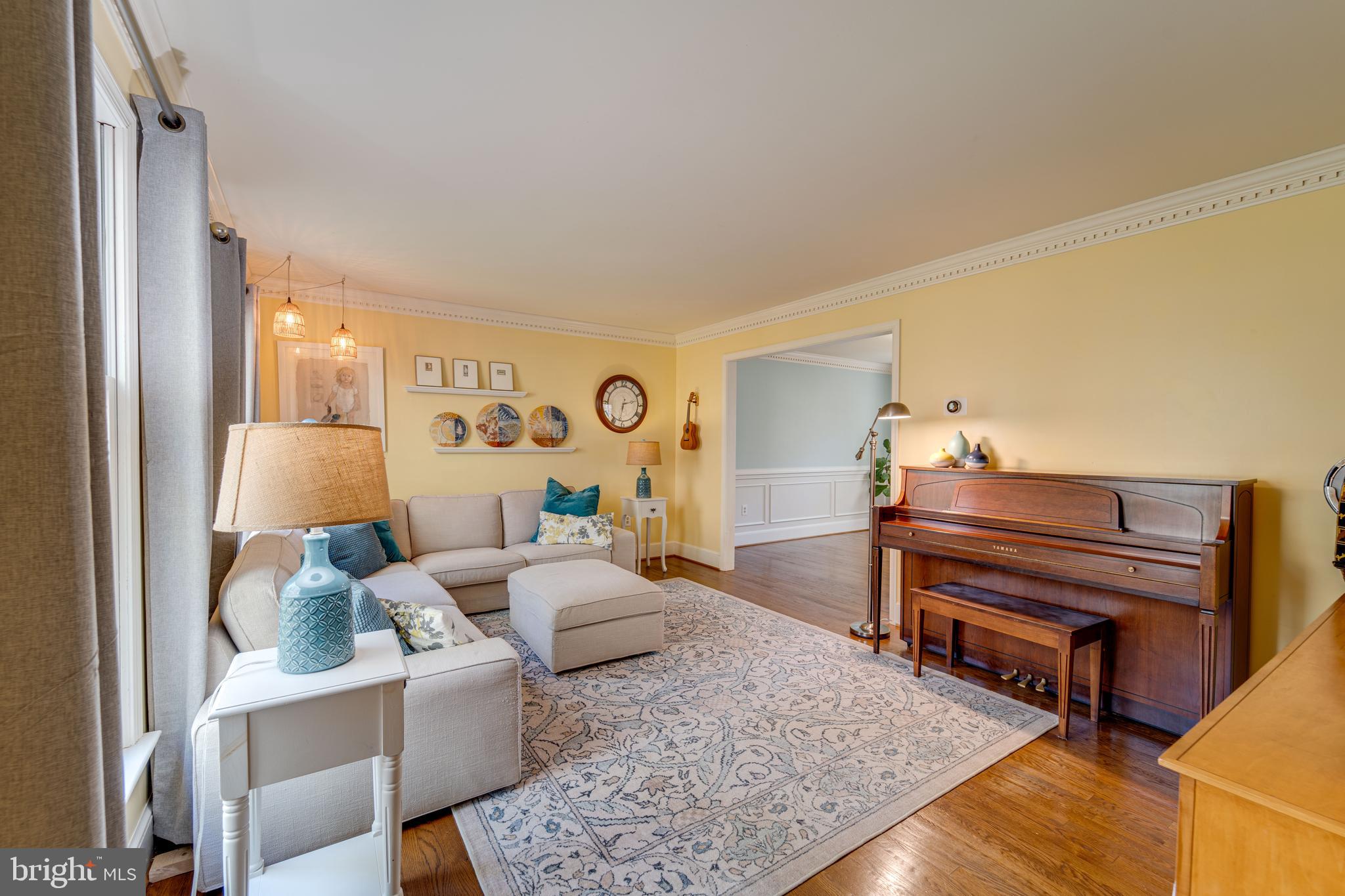 8232 Honeysuckle Road Manassas, VA 20112 - Photo 9 of 76 a living room with furniture and a piano