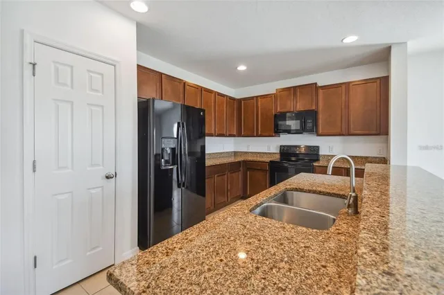 a view of kitchen with wooden floor