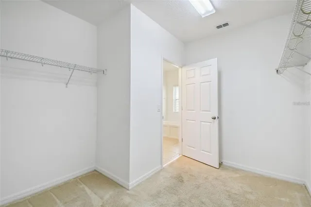 a view of a room with racks on the wall