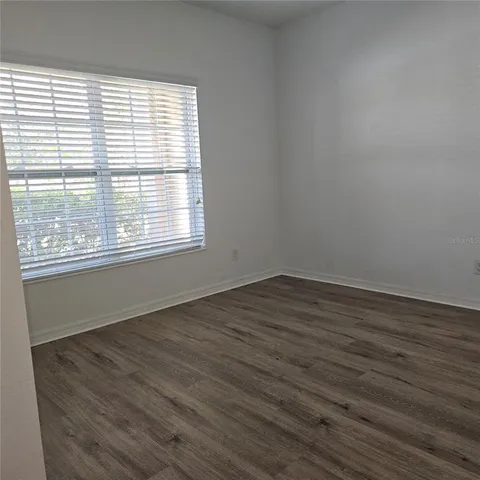 a swimming pool with outdoor seating and yard