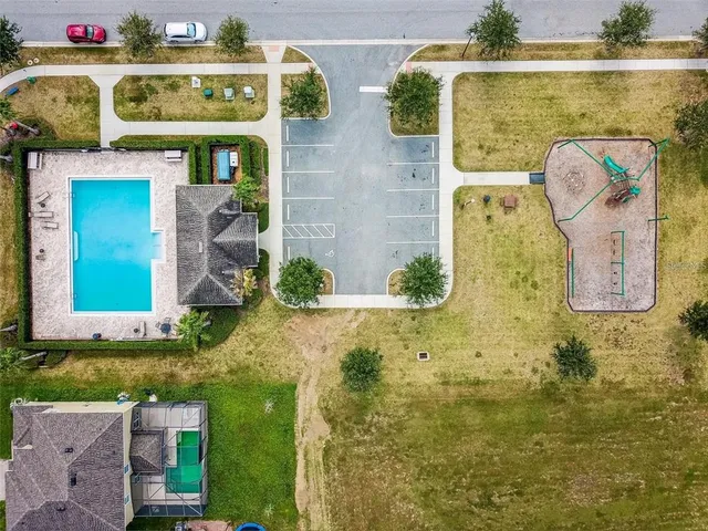an aerial view of a house with a garden and plants