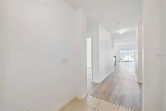 a kitchen with stainless steel appliances granite countertop a refrigerator and stove