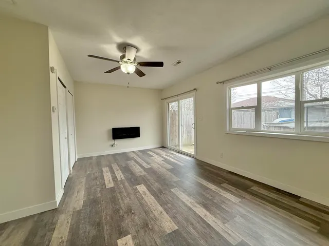 a view of an empty room with a window