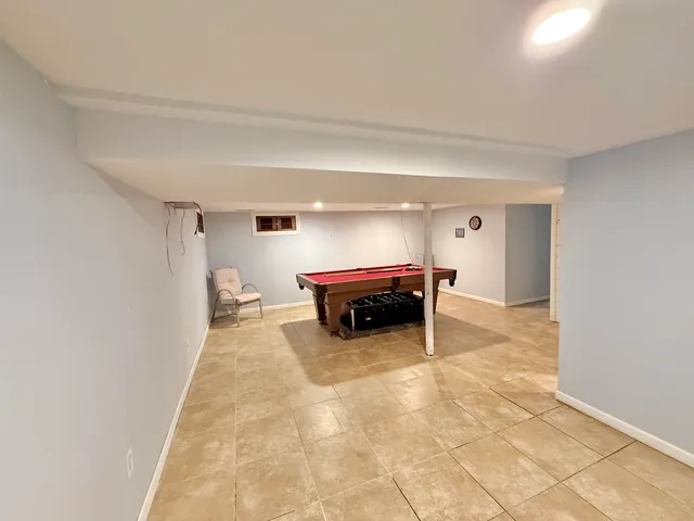 a room with furniture and a chandelier