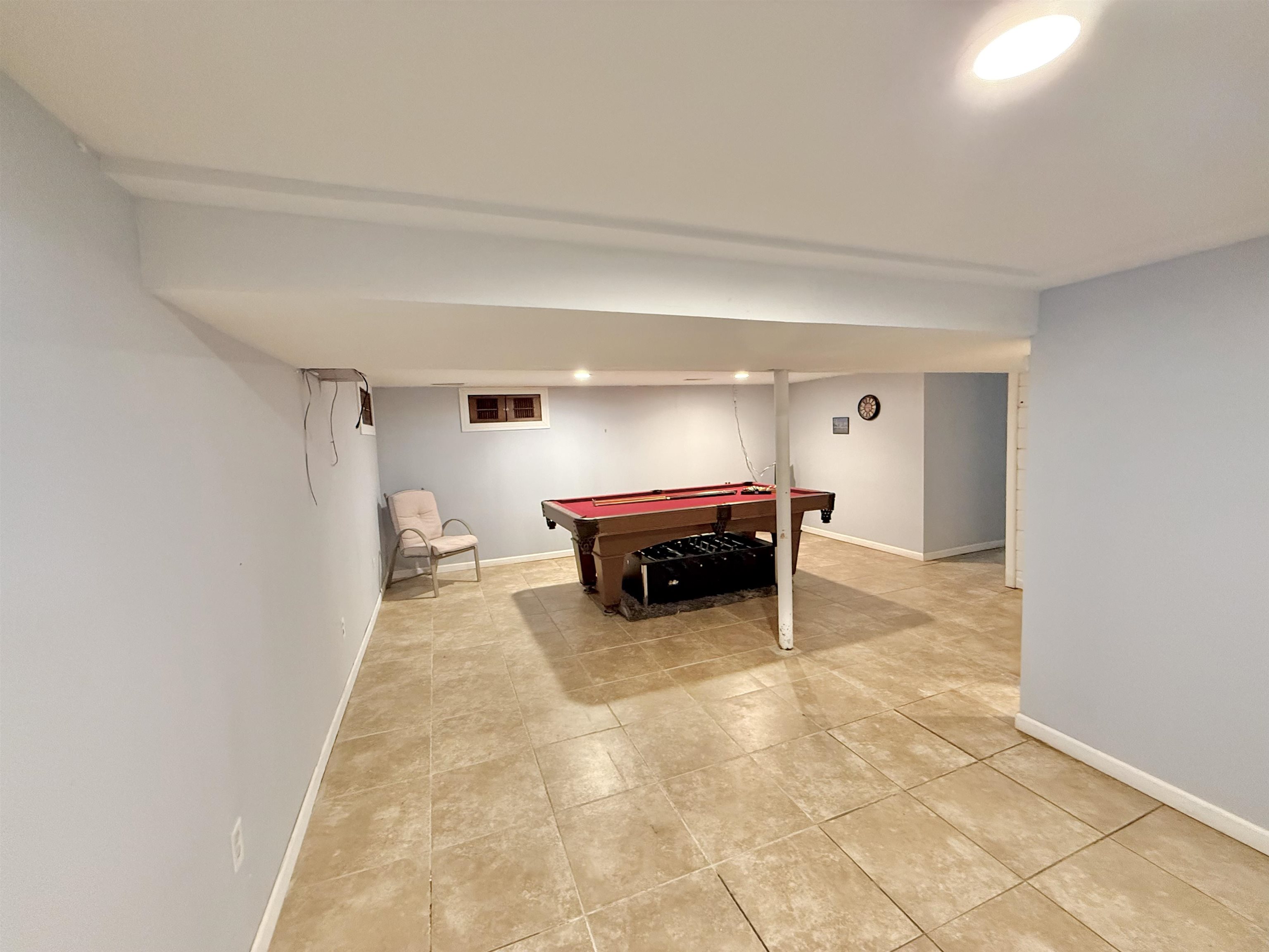 8432 Ravere Street Machesney Park, IL 61115 - Photo 23 of 31 a room with furniture and a chandelier