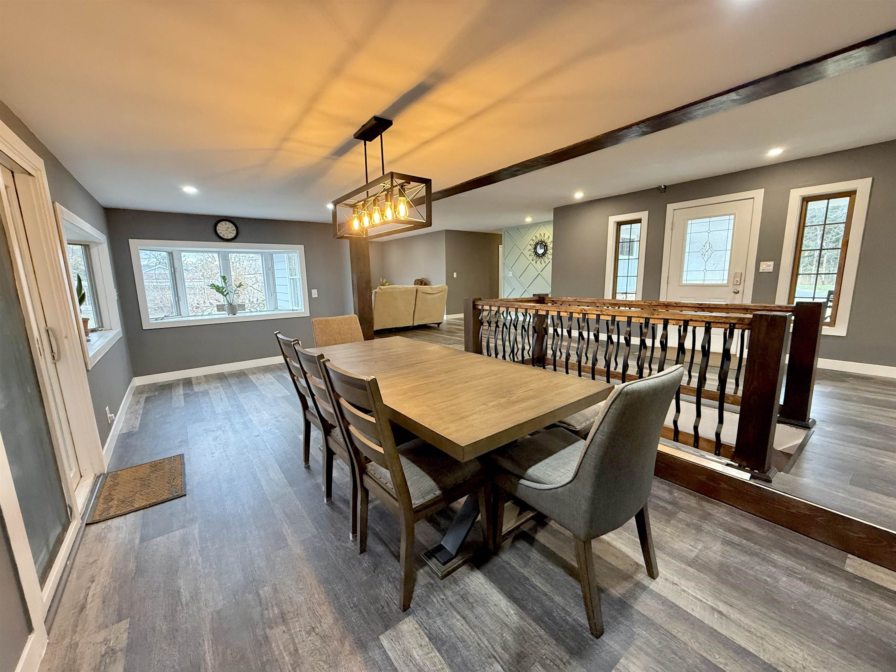 8432 Ravere Street Machesney Park, IL 61115 - Photo 4 of 31 a view of a dining room with furniture window and wooden floor