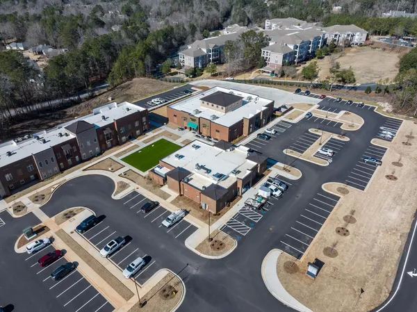 an aerial view of residential houses with outdoor space