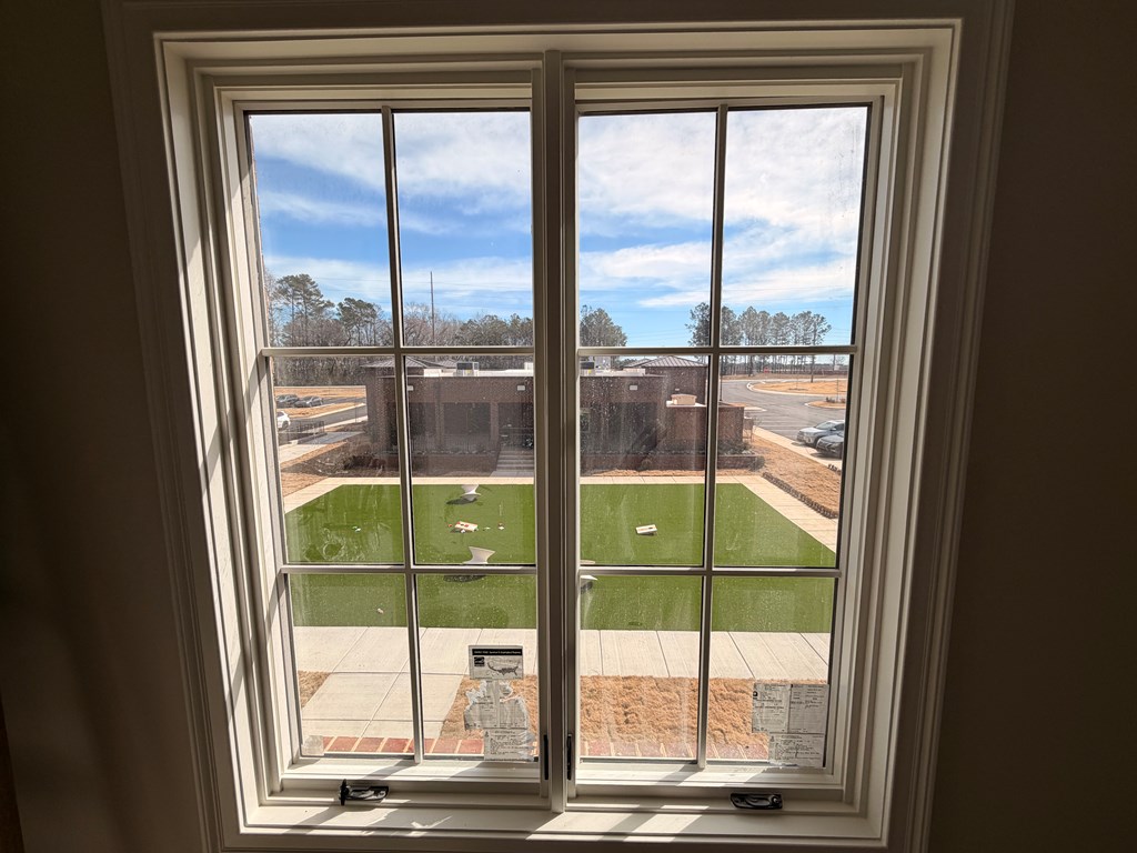 6801 River Road, Unit 406 Columbus, GA 31904 - Photo 7 of 10 a view of a glass door from a window