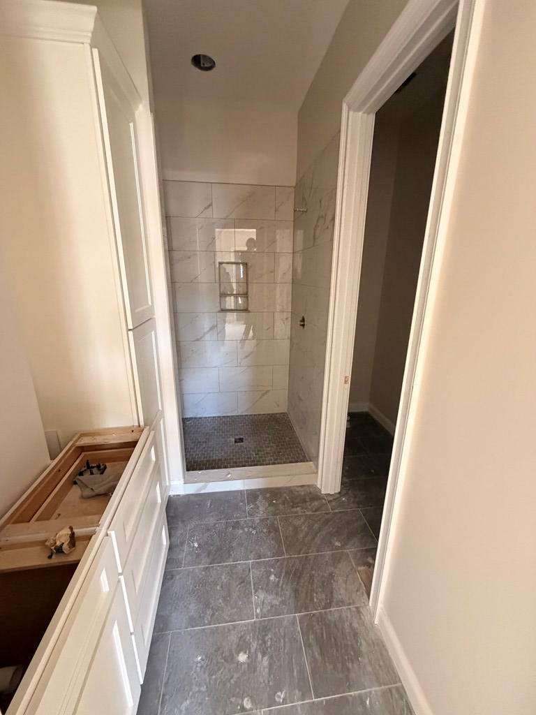 6801 River Road, Unit 406 Columbus, GA 31904 - Photo 8 of 10 a bathroom with a glass door shower and a sink